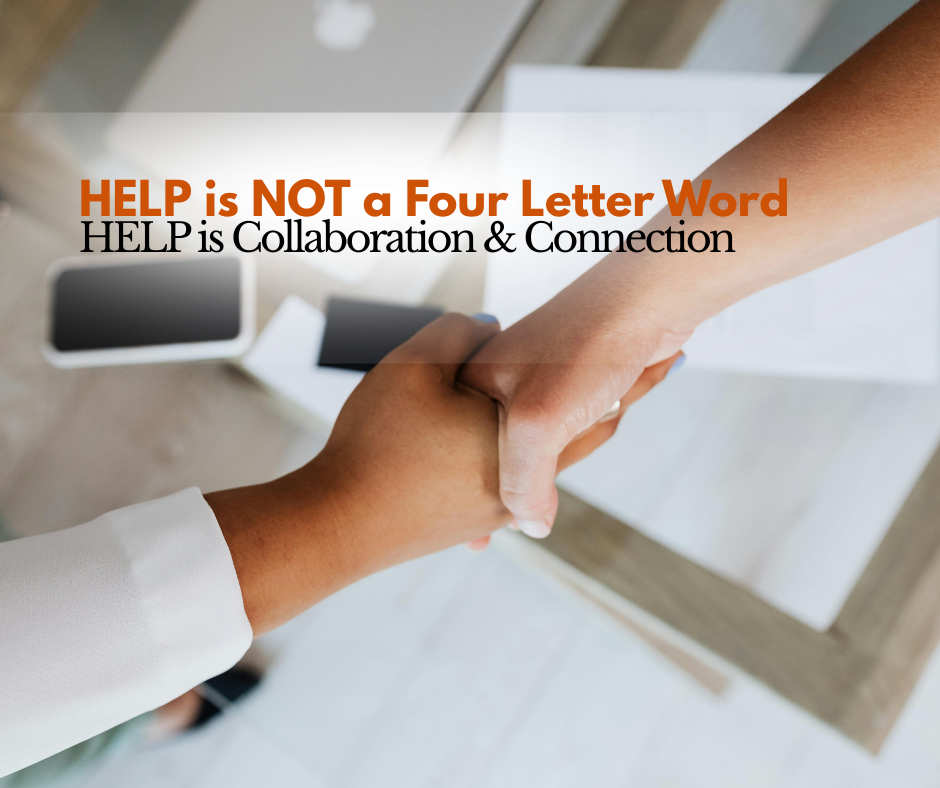 Two professionals shaking hands across a desk symbolizing collaboration, connection, and accepting help without feeling weak in leadership and work environments.